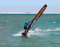 Before peppering into the Carving-360, first check the free space to leeward and get plenty of speed upwind. Put your back foot out of the straps onto the leeward edge and unhook yourself from the harness. As with a carved jibe, a wide handle on the boom will help you to start the turn with plenty of speed.