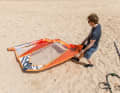Furl the sail in the direction of the wind