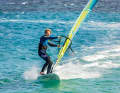 You initiate a leeward turn by moving the back foot out of the strap towards the leeward edge