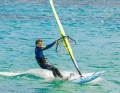 To carve to windward, move the back foot slightly towards the windward edge