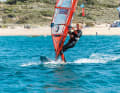 Then pull the sail towards you with both arms and push your hips forwards