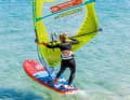 To drop, move the sail forwards past the body, the mast tilts to windward and the boom end goes up. The board now begins to turn to leeward.