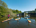 Hamburg and Altes Land: SUP beginners can experience a mini-adventure on an easy paddle tour on the Dove Elbe.