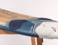 The volume is more concentrated in the tail, the board becomes thinner towards the front and the deck is slightly concave.