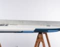 The flat gliding surface starts approximately at the centre fin.