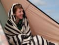 It can even be turned into a poncho with a hood!