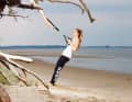 Pull your arms towards your body and maintain body tension. Return to the starting position by stretching your arms evenly