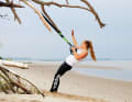 Grasp both handles with one hand and bring the sling trainer to tension by slightly reclining it