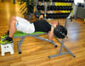 Bench press: Grip the barbell well above shoulder width and then slowly lower it to your chest.