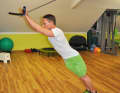 This exercise trains your entire core muscles! Bend forwards as far as possible and make yourself as long as possible...