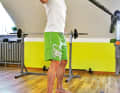 ...and pull the elasticated band backwards. The upper arm is also the axis of rotation here.