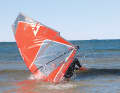 If the technique and wind strength are right, you will land on your back on the lee side of the water. The sail has then completed half to three-quarters of a rotation. Repeat this pre-exercise until it has become second nature to you - apart from the benefits, this exercise is also a lot of fun.