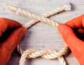 Cross both ends again, now right over left.