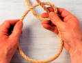 Pull the working end (from back to front) slightly out of the eye.