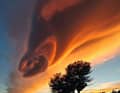 Mistral gusts threaten on the east coast of Corsica, when conspicuously stacked lenses of clouds with an oval outline form in the sky.