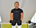 ...and then lower it again. Make sure that you don't bungle with your upper body and gain momentum.