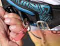 A thin spring plate secures the hook - you should check here whether it has snapped shut properly
