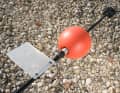 The rudder is a piece of plastic from an old transport box, held in place by two cable ties. The floating ball sits firmly on the tube.