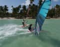 How close can a sailing top get to the photographer on the ladder?