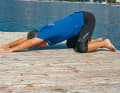 Get into a quadruped position, place both hands on the floor far in front of you