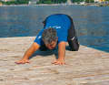 Move back towards your heels, keep your hands firmly on the floor and lower your chest as low as possible. Pull your bum away from your hands until you feel the relaxation between your shoulder blades and lower back
