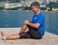 Now pull your knee towards your chest. It pulls in the left buttock