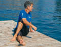 Support yourself with your elbow on your knee. Also relax your lower back. Stretch both sides.