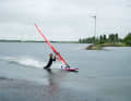 At best, your shins will just get wet. Try to pull yourself as close as possible to the boom with your chest...