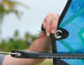 Ezzy has three ropes hanging from the clew that indicate how far above the neutral zero point the boat should be pulled.