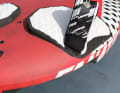 Sharp edges and extremely far out footstrap positions to be able to control the board at full speed for as long as possible. Loop positions further inwards are generally not available.