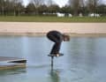 After the cat jump onto the board, bring both feet into the right position as quickly as possible. Your hands provide a little extra control. You are still on all fours.