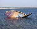 The result: the wind catches the sail and the rig flips uncontrollably