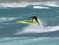 The jump to the backside aerial is not really a jump in the true sense of the word, but rather a levering out over the flattened sail.