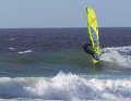Get as much speed as possible on the wave as it builds up and aim for the wave upwind.