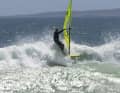 You shift your body weight heavily over the tail. The bottom line is that the impulse for edging the board comes solely from the rider's weight shift, less from the sail.