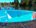 The deck pad extends far forward of the centre of the board and to the tail.