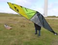 After you have removed the boom, turn the sail top to windward (upwind)
