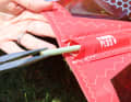 Use long, pointed pliers to pull out the end of the batten