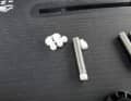 The screw length can be adjusted using small plastic spacers