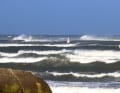 Even further to windward, official waves rolled in