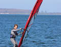 Initiate the turn to leeward by applying a measured load to the leeward edge. The aim should be a large radius.