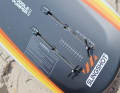 The mast is hooked under the front of the box...