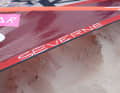 His signature sail wheel also bears elements: The lettering...