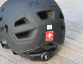 The size can be adjusted at the back of the head, the adjustment wheel is easily accessible
