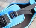 The harness is secured to the body with a narrow elasticated band