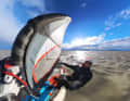 Father Christmas surfing two days before Christmas in Podersdorf on Lake Neusiedl (Austria)