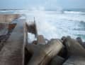 Many stretches of coastline are protected against tsunamis by massive structures, making it difficult to land