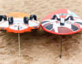 The further out the straps are mounted (left, freerace board), the more difficult it is to get on