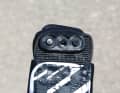 You can simply turn the black plastic parts through which the loop is screwed round so that the wide side moves inwards. This makes the loop about five millimetres narrower on each side.