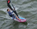 While the board continues to drop downwind, you now climb out of the front loop almost like a split and position your front foot in front of the base plate (as in a fast tack).